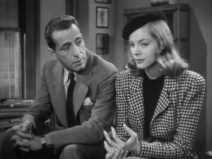 Marlowe and leading lady, similarly suited